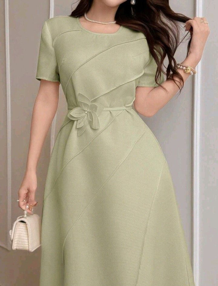 Shein Dress (Category: Dresses) located in Manila. Submitted by rtins (Listing ID 1445753950, Image 2). Description: - Sage green midi dress - Textured fabric with diagonal paneling - Cute flower detail at the waist - Short sleeves and round neckline - Versatile for events or casual wear - Flattering and pretty fit.