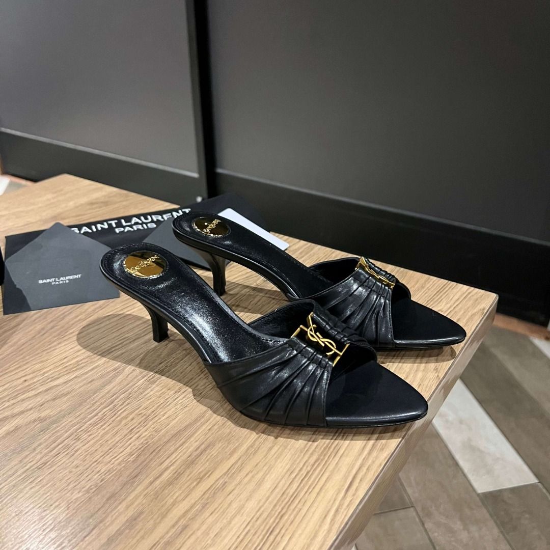 Saint Laurent Black Leather YSL Heels (Category: Heels) located in Malabon City. Submitted by bakrsayma51009 (Listing ID 1445686216, Image 1). Description: - Authentic Saint Laurent black leather mules - Iconic YSL logo hardware - Elegant pointed toe - Comfortable kitten heel - Easy slip-on design - Comes with original Saint Laurent dust bag and box.
