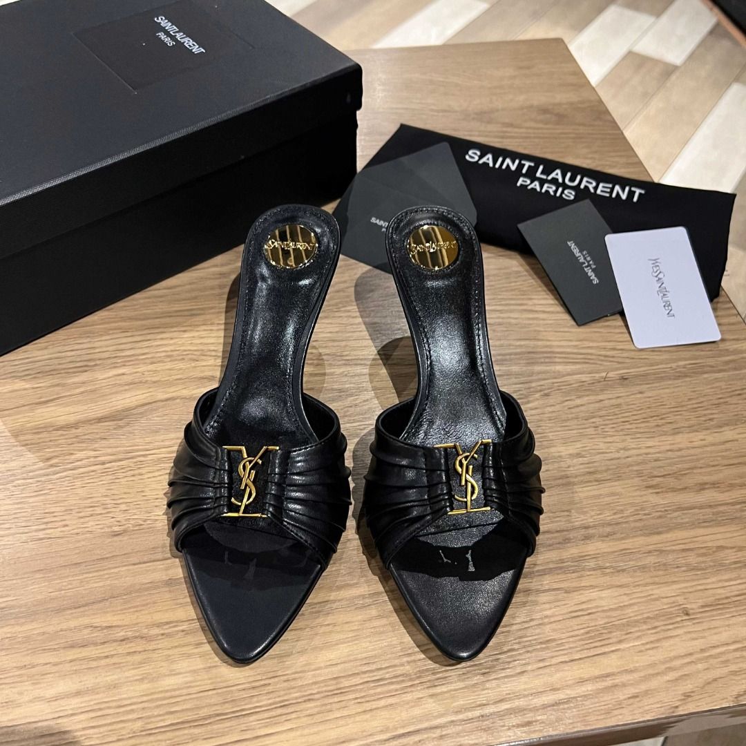 Saint Laurent Black Leather YSL Heels (Category: Heels) located in Malabon City. Submitted by bakrsayma51009 (Listing ID 1445686216, Image 3). Description: - Authentic Saint Laurent black leather mules - Iconic YSL logo hardware - Elegant pointed toe - Comfortable kitten heel - Easy slip-on design - Comes with original Saint Laurent dust bag and box.
