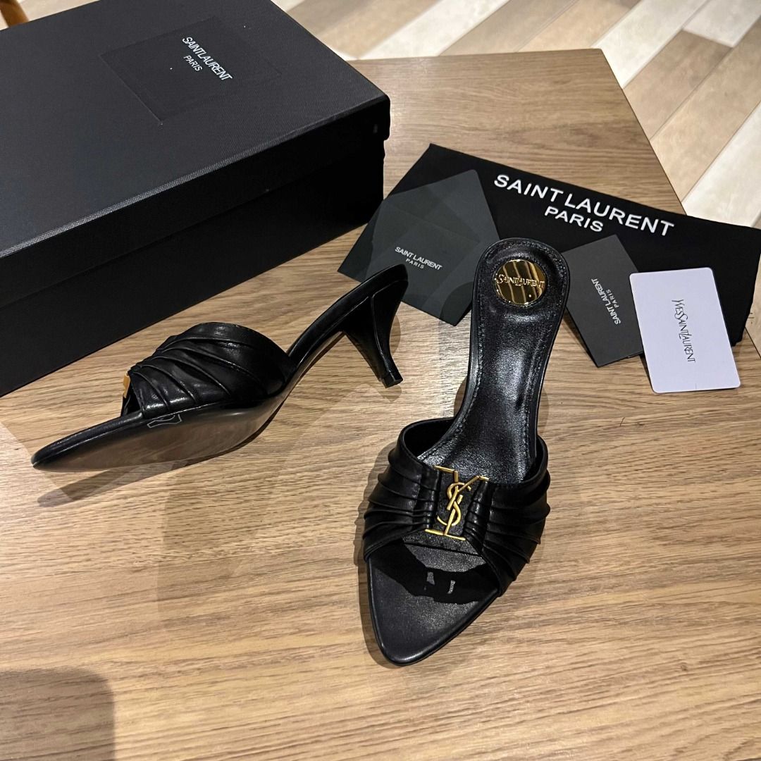 Saint Laurent Black Leather YSL Heels (Category: Heels) located in Malabon City. Submitted by bakrsayma51009 (Listing ID 1445686216, Image 2). Description: - Authentic Saint Laurent black leather mules - Iconic YSL logo hardware - Elegant pointed toe - Comfortable kitten heel - Easy slip-on design - Comes with original Saint Laurent dust bag and box.