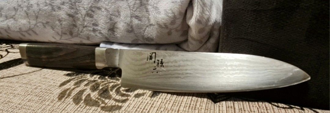 Sakai Takayuki Damascus Chef Knife (Category: Knives & Chopping Boards) located in Baguio. Submitted by kimotong (Listing ID 1445667466, Image 1). Description: Japanese Damascus chef knife. Features a beautiful wavy pattern on the blade. Dark wood handle with a metal bolster. Sharp and well-balanced. Great for all your kitchen prep needs. Brand : Sekimagoroku Sekimagoroku and Shun are brands of the same company. And sekimagoroku is made in Japan 