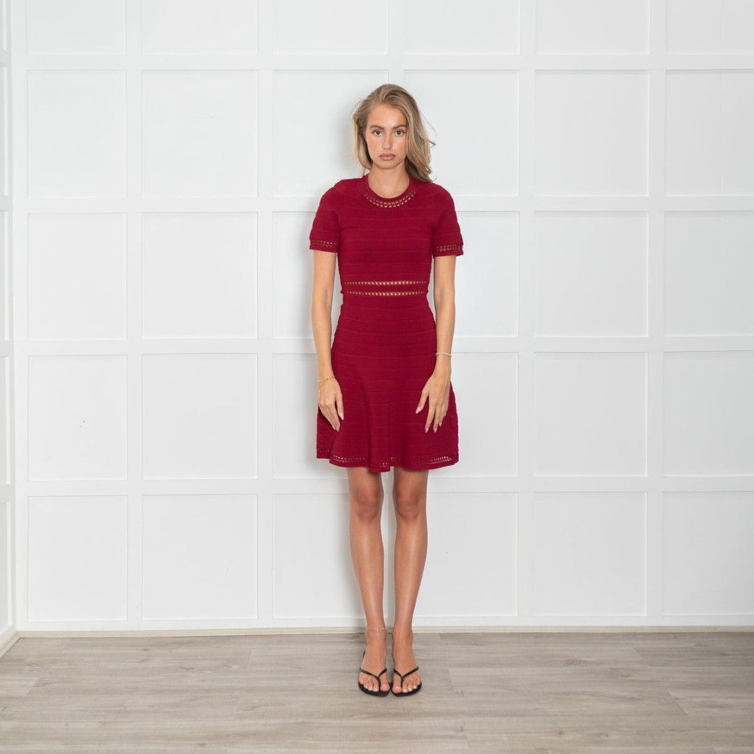 Sandro Burgundy Knitted Mini Dress (Category: Dresses) located in Pagudpud. Submitted by altheacee063978 (Listing ID 1445667010, Image 2). Description: - Deep red short sleeve knit dress - Flattering fit and flare silhouette - Unique cutout details on neckline, sleeves, and waist - Textured stripe pattern in the knit fabric - Versatile for night outs or special occasions - Easy to dress up or down.