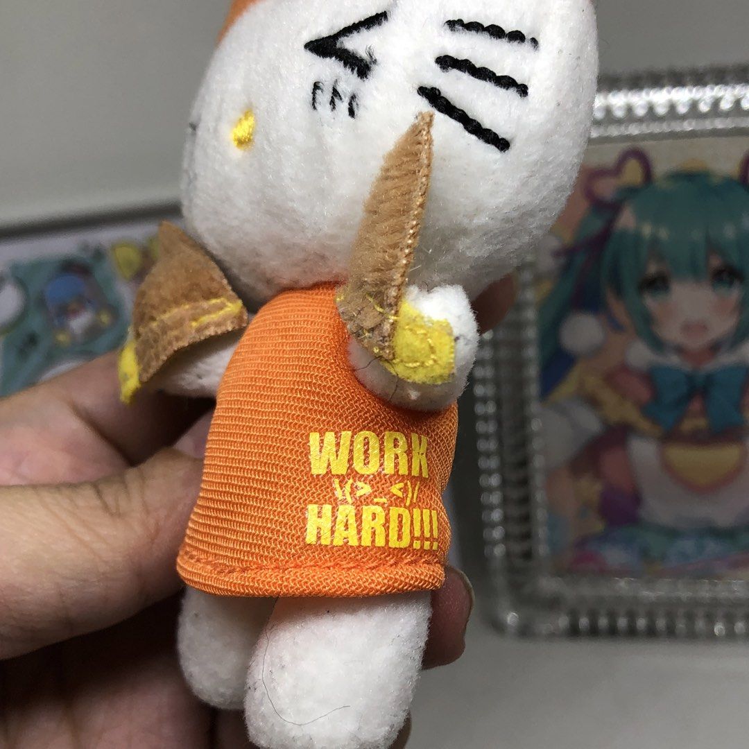 SANRIO HELLO KITTY WORK HARD PLUSH CHARM (Category: Plushies & Soft Toys) located in Quezon City. Submitted by kitsune.treasures (Listing ID 1445642934, Image 2). Description: *First to pay policy! *1 day reservation only. Failure to pay on time, auto cancel. 📍Quezon City * MOD: J&T | Lalamove * MOP: GCASH | BPI 📦ON HAND AND READY TO SHIP CONDITION: WHAT YOU SEE IS WHAT YOU GET. Dimensions: Kindly check the photos for the actual measurements. P