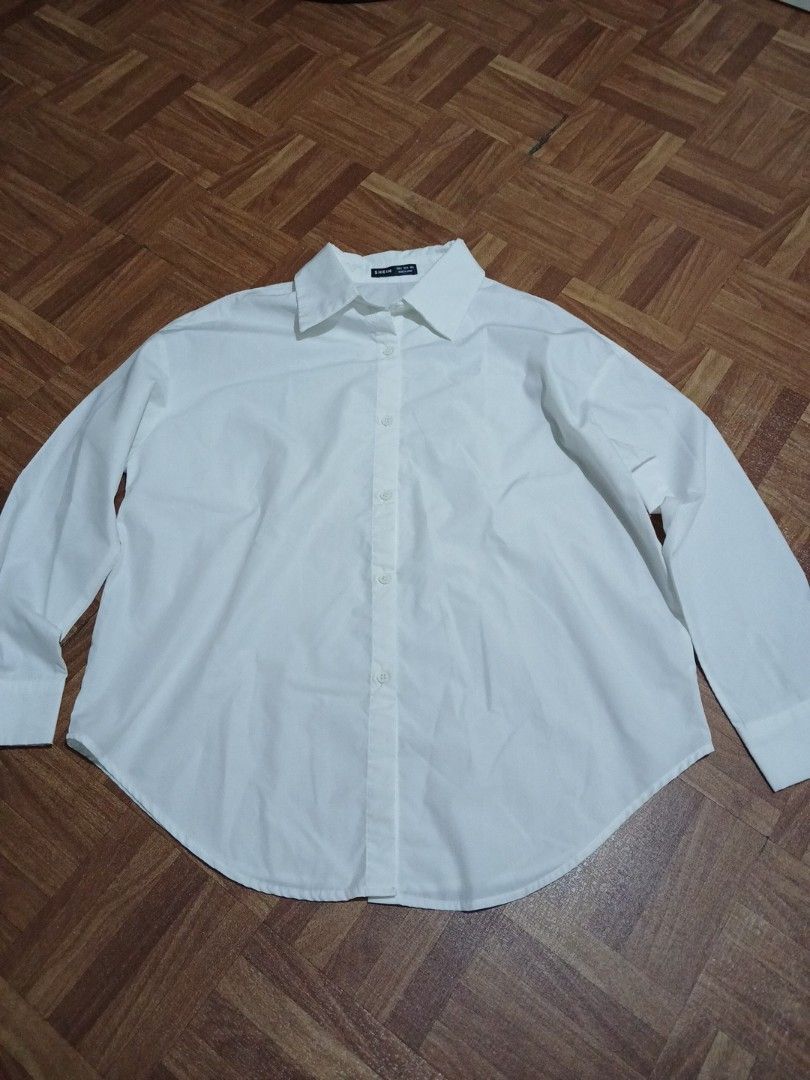 ‼️SALE‼️SHEIN White Long Sleeve Button Up Shirt OVERSIZED (Category: Longsleeves) located in Marikina City. Submitted by Yaners (Listing ID 1445628102, Image 1). Description: - Classic white long sleeve shirt from SHEIN - Button-up front with a collar - Versatile for any occasion - Suitable for work or casual wear - Please check photos for details SLEEVE LENGTH 19 inches ARMPIT 21 inches LENGTH 26 inches.