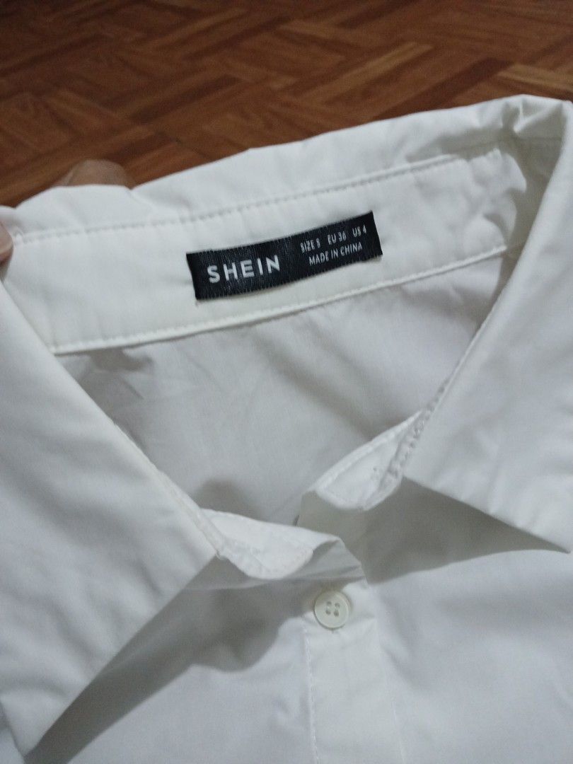 ‼️SALE‼️SHEIN White Long Sleeve Button Up Shirt OVERSIZED (Category: Longsleeves) located in Marikina City. Submitted by Yaners (Listing ID 1445628102, Image 2). Description: - Classic white long sleeve shirt from SHEIN - Button-up front with a collar - Versatile for any occasion - Suitable for work or casual wear - Please check photos for details SLEEVE LENGTH 19 inches ARMPIT 21 inches LENGTH 26 inches.