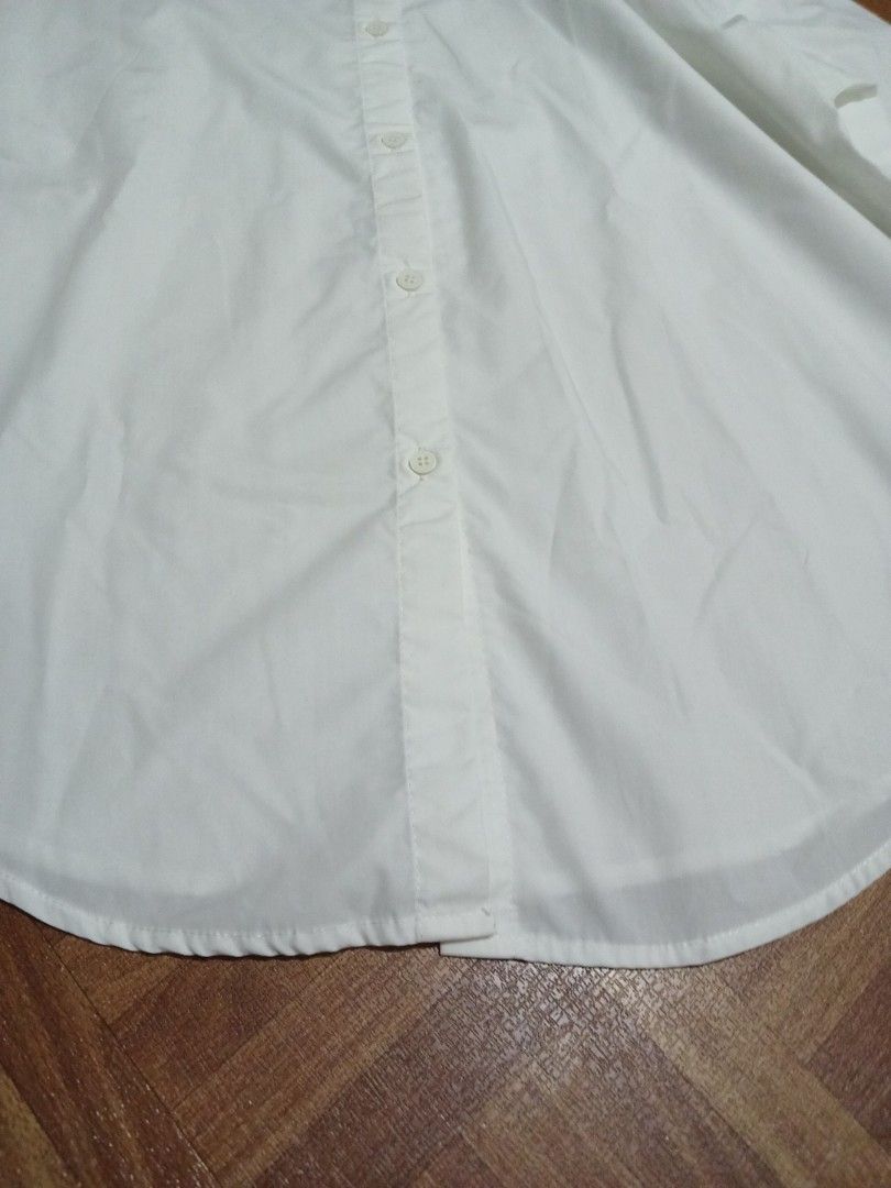 ‼️SALE‼️SHEIN White Long Sleeve Button Up Shirt OVERSIZED (Category: Longsleeves) located in Marikina City. Submitted by Yaners (Listing ID 1445628102, Image 3). Description: - Classic white long sleeve shirt from SHEIN - Button-up front with a collar - Versatile for any occasion - Suitable for work or casual wear - Please check photos for details SLEEVE LENGTH 19 inches ARMPIT 21 inches LENGTH 26 inches.
