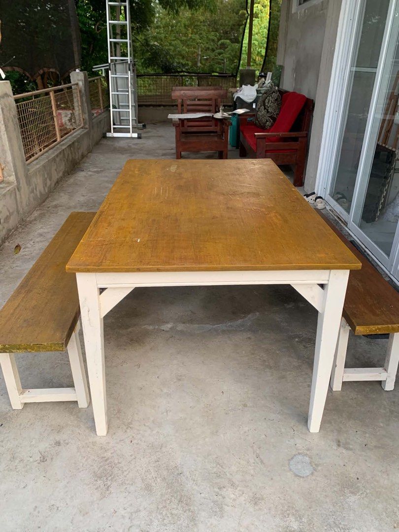 Solid Wooden Dining Table with 2 Benches (Category: Tables & Sets) located in Paombong. Submitted by ronalynr13 (Listing ID 1445647623, Image 2). Description: - Wooden dining table with two matching benches - Light wood tabletop with white legs - Benches also feature wood tops and white legs - Ideal for small spaces or casual dining areas - Suitable for patio or indoor use - Note: Tabletop shows some signs of wear.