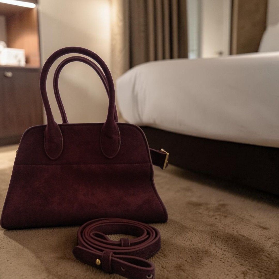 THE ROW MARGAUX 10 BURGUNDY SUEDE (Category: Luxury Bags & Wallets) located in Bulacan. Submitted by HersMinePhils. (Listing ID 1445647139, Image 2). Description: THE ROW MARGAUX BAG – BURGUNDY SUEDE from LE BON MARCHE Paris The Bag That Defines Quiet Luxury Some luxury bags demand attention. THE ROW Margaux doesn't have to. Recognized as one of the most coveted handbags in the world, the Margaux has become a favorite among Hollywood celebrities,