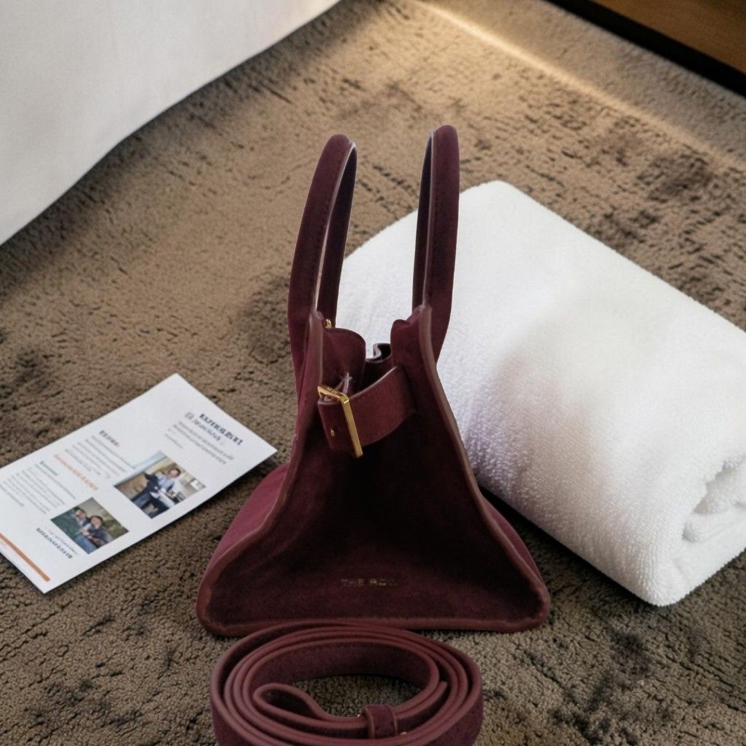 THE ROW MARGAUX 10 BURGUNDY SUEDE (Category: Luxury Bags & Wallets) located in Bulacan. Submitted by HersMinePhils. (Listing ID 1445647139, Image 3). Description: THE ROW MARGAUX BAG – BURGUNDY SUEDE from LE BON MARCHE Paris The Bag That Defines Quiet Luxury Some luxury bags demand attention. THE ROW Margaux doesn't have to. Recognized as one of the most coveted handbags in the world, the Margaux has become a favorite among Hollywood celebrities,