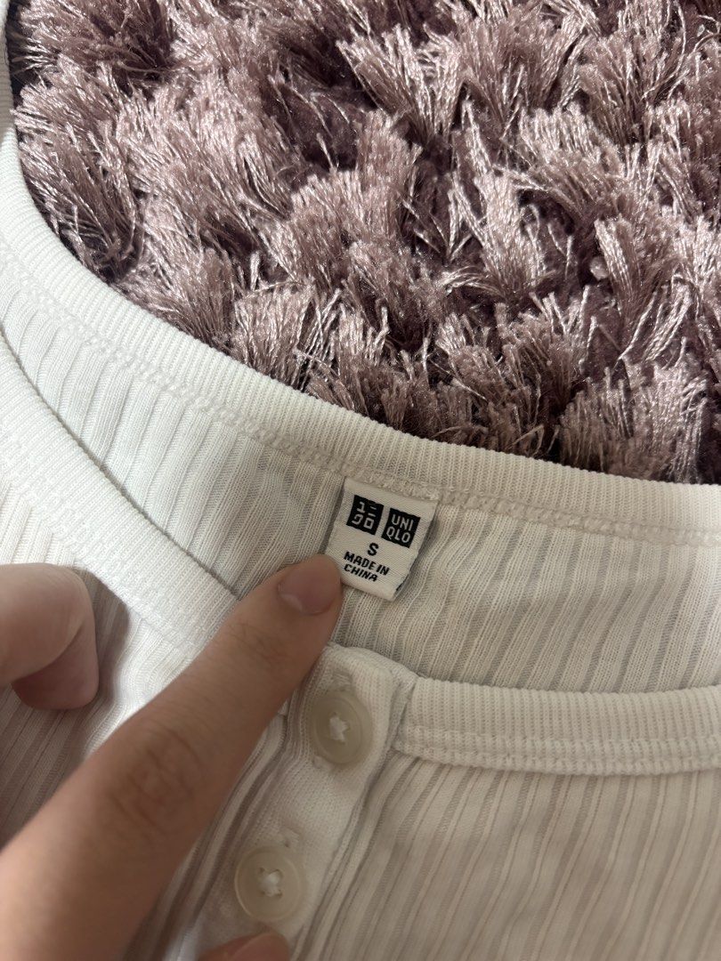 Uniqlo White Tank Top (Category: Sleeveless) located in Quezon City. Submitted by jjccly (Listing ID 1445735144, Image 3). Description: size small on tag has minimal yellowing in underarm (barely visible)(see last pic) rfs: decluttering mop gcash mod lalamove loc qc.