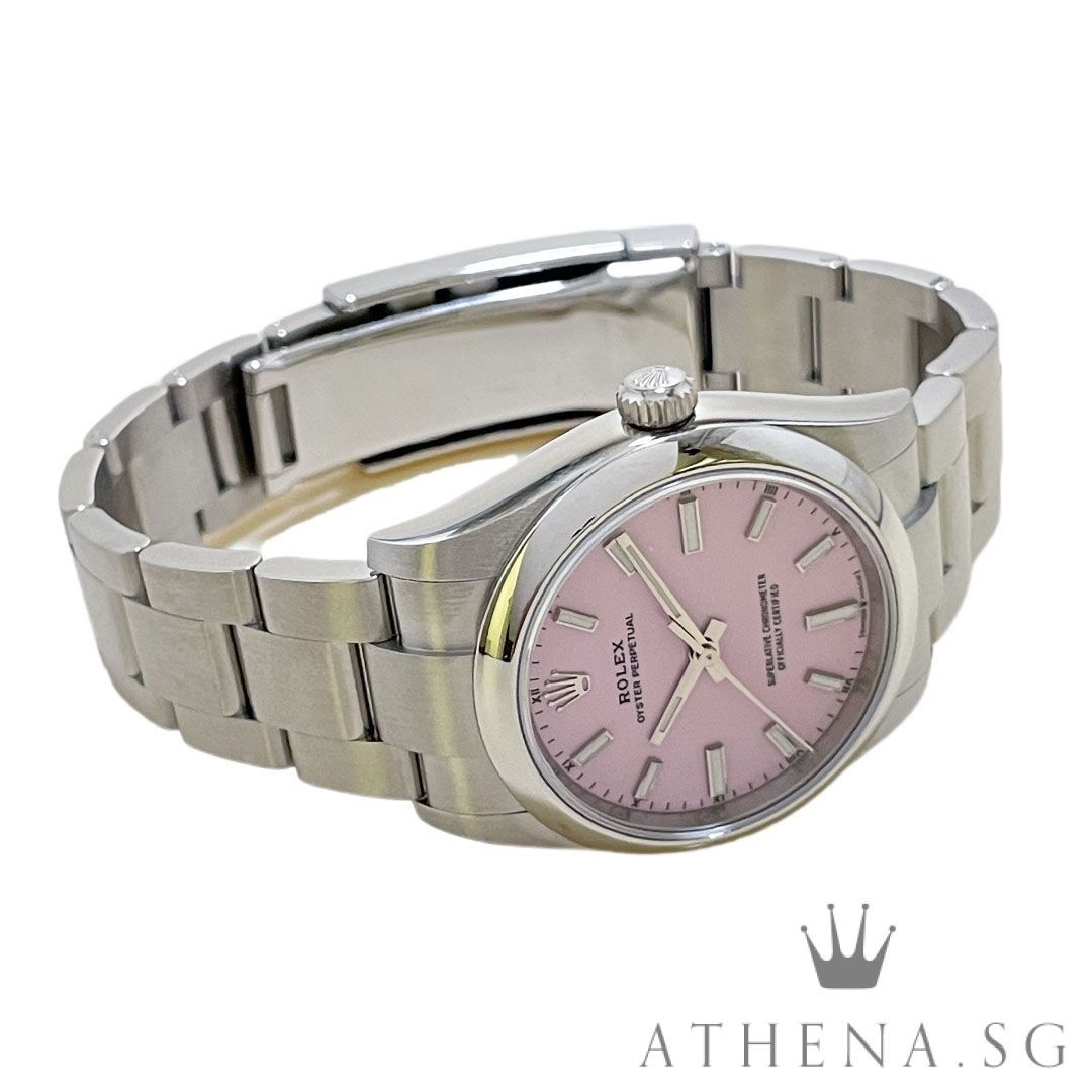 UNWORN!! ROLEX OYSTER PERPETUAL 34 “AN” SERIES “CANDY PINK INDEX DIAL” WITH BOX & CERT DATED (06/2026) (STILL UNDER AGENT WARRANTY) 124200 (Category: Watches) located in Singapore. Submitted by athenawatches (Listing ID 1445615799, Image 2). Description: JGWRL_3462 Brand Rolex Model 124200 Series Alpha Numeric Colour of Dial Candy Pink Dial with Luminescent Index Markers Bezel Oystersteel Domed Bezel Case Diameter 34mm Case Material Stainless Ste