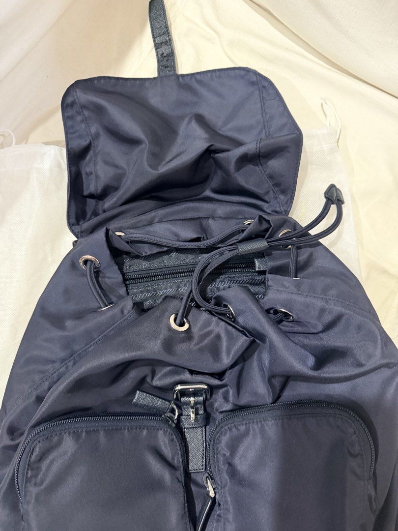Used 3x Authentic Prada Backpack Navy shw (Category: Luxury Bags & Wallets) located in Makati City. Submitted by georgiaetc (Listing ID 1445673464, Image 2). Description: Excellent condition Super clean inside out Bought from prada outlet store italy in 2018 Stored & barely used No dustbag Bag only Do not offer if in doubt Pay before booking / shipping Open for meet ups Super duper nice in actual .