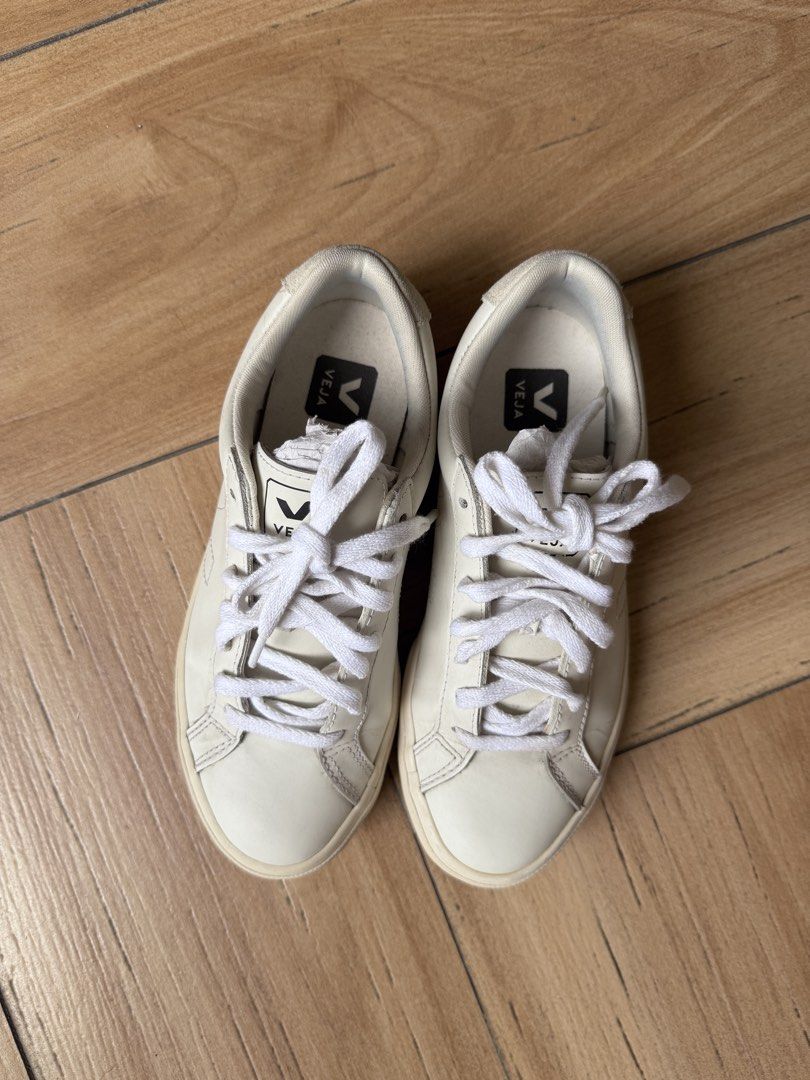 Veja Sneakers White Leather Lace-up (Category: Sneakers) located in Rodriguez. Submitted by cords.treasure (Listing ID 1445669758, Image 1). Description: - White Veja sneakers - Genuine leather material - Lace-up closure for a secure fit - Signature Veja logo on the side and heel - Comfortable for all-day wear - Ideal for casual outfits - Soles show some wear.