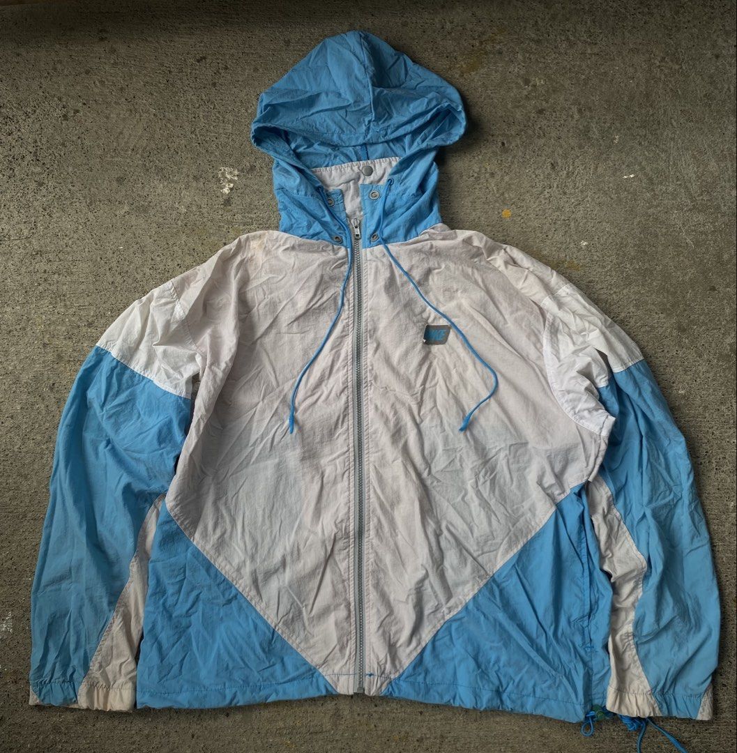 Vintage 90s nike windbreaker jacket (Category: Coats, Jackets and Outerwear) located in Kalibo. Submitted by bryaninosa20819 (Listing ID 1445617727, Image 1). Description: Vintage 90s nike windbreaker jacket Dimes : 26x27 Boxy Very Good Condition Color Rate 9/10 Need Wash Washable Stain.