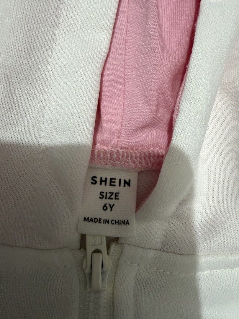 White Hoodie Dress (Category: Babies & Kids Fashion) located in Cavite. Submitted by thehiddenhanger (Listing ID 1445665370, Image 2). Description: - White hoodie dress from SHEIN - Short sleeves - Front kangaroo pocket - Pink fabric lining inside the hood - Cute embroidered dog on the chest - Zipper closure at the neck - Ideal for casual wear.