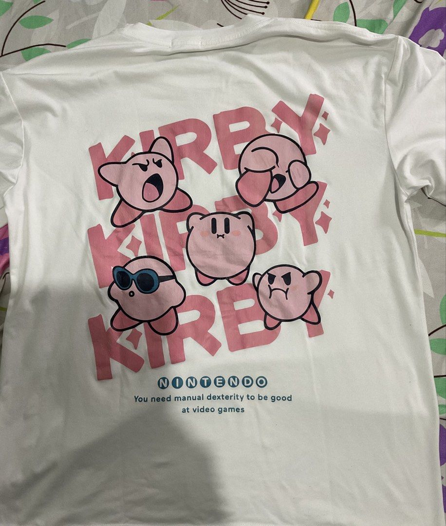 White Kirby Nintendo T-shirt (Category: Shirts) located in Manila. Submitted by mlnflrs (Listing ID 1445697217, Image 2). Description: - White t-shirt with adorable Kirby graphic - Features multiple Kirby poses on front and back - Includes Nintendo logo - Perfect for Kirby and Nintendo fans - Comfortable and stylish design.