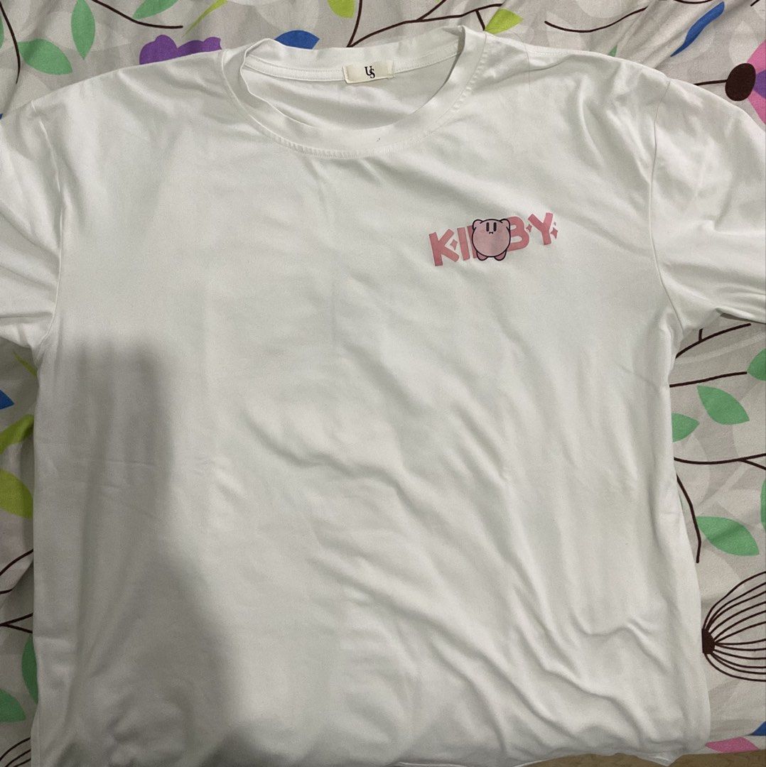 White Kirby Nintendo T-shirt (Category: Shirts) located in Manila. Submitted by mlnflrs (Listing ID 1445697217, Image 1). Description: - White t-shirt with adorable Kirby graphic - Features multiple Kirby poses on front and back - Includes Nintendo logo - Perfect for Kirby and Nintendo fans - Comfortable and stylish design.