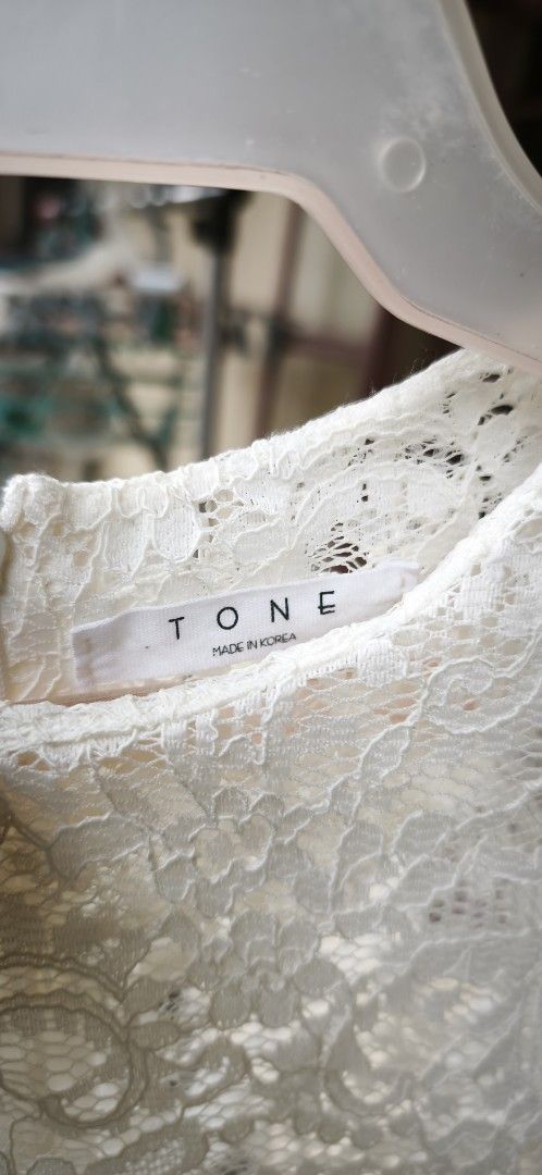 White Lace Blouse - Padded Shoulders, Back Zipper (Category: Blouses) located in Malabon City. Submitted by ph_ohkaye (Listing ID 1445624373, Image 3). Description: - Brand: TONE - Style: White lace blouse - Features: See-through lace overlay, small padded shoulders, mid-length sleeves, back zipper closure - Fit: Fits Medium to Large - Styling: Great for layering or wearing on its own 56 cm LENGHT pit to pit 43cm.