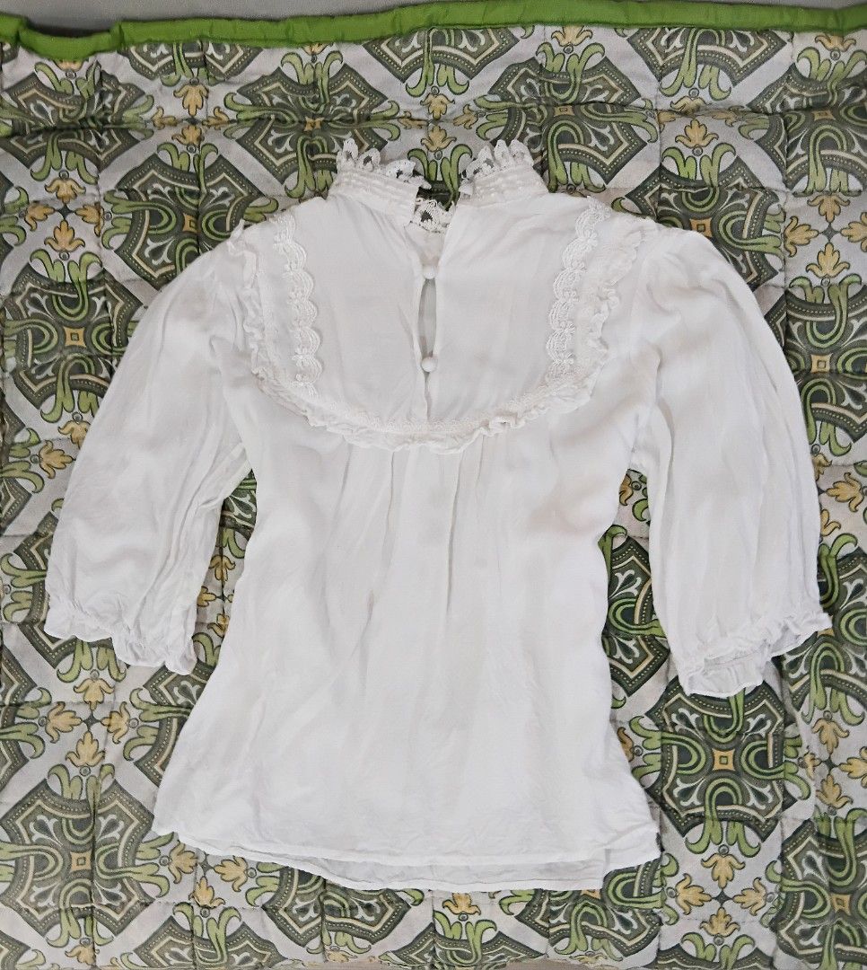 White Lace Trimmed High Neck Blouse (Category: Blouses) located in Los Banos. Submitted by alyanizuu (Listing ID 1445640387, Image 1). Description: estimate size: M manipis ng kaunti pero hindi see- through.