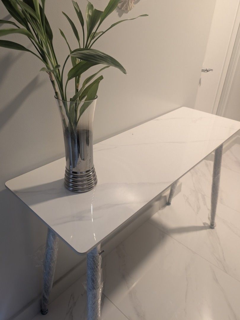 White Marble Top Console Table 120cm length and 81cm height (Category: Tables & Sets) located in Manila. Submitted by seanapaul (Listing ID 1445664702, Image 2). Description: White console side table - Marble-effect top - Sleek metal legs (protective plastic still on) - Ideal for hallways or as a display table - Approximately 120cm long 40cm depth 81cm height - Easy to clean surface - Modern home aesthetic pick up BGC.