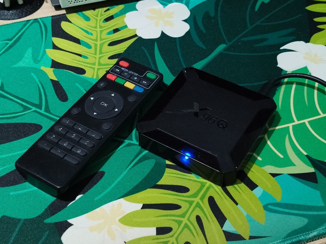 X96Q Android Smart TV 4K Media Player Box (Category: TV) located in Taguig. Submitted by kcdthriftshoppe (Listing ID 1445716441, Image 1). Description: Turn any ordinary TV into a fully functional Smart TV! This compact Android TV box is the ultimate budget setup for streaming your favorite shows, playing retro games, or casting your phone screen directly to the big screen. Condition: Well-used and fully functional. It comes pre-packed with essen