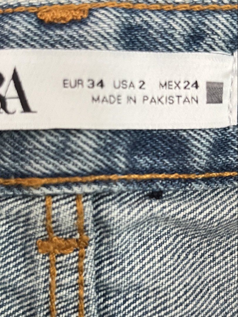 ZARA Blue Distressed Wide Leg Jeans (Category: Jeans) located in Marikina City. Submitted by taylorm31 (Listing ID 1445614321, Image 3). Description: - Brand: ZARA - Style: High-waisted blue denim jeans - Closure: Button fly - Details: Distressed knees and thighs - Fit: Wide leg with raw hem and side slits - Origin: Made in Pakistan - Size: EUR 34 (US 2, MEX 24) MOP: BPI / Gcash .