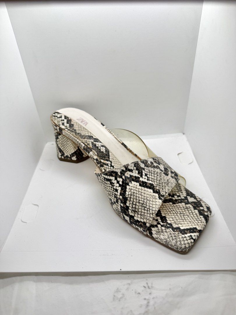 ZARA snake skin slide sandals (Category: Sandals) located in Mandaluyong City. Submitted by cherryspicks (Listing ID 1445690088, Image 2). Description: Worn 3x. The see-through part has discolored but when worn it is not obvious . Featuring a comfortable block heel. Size US 8.