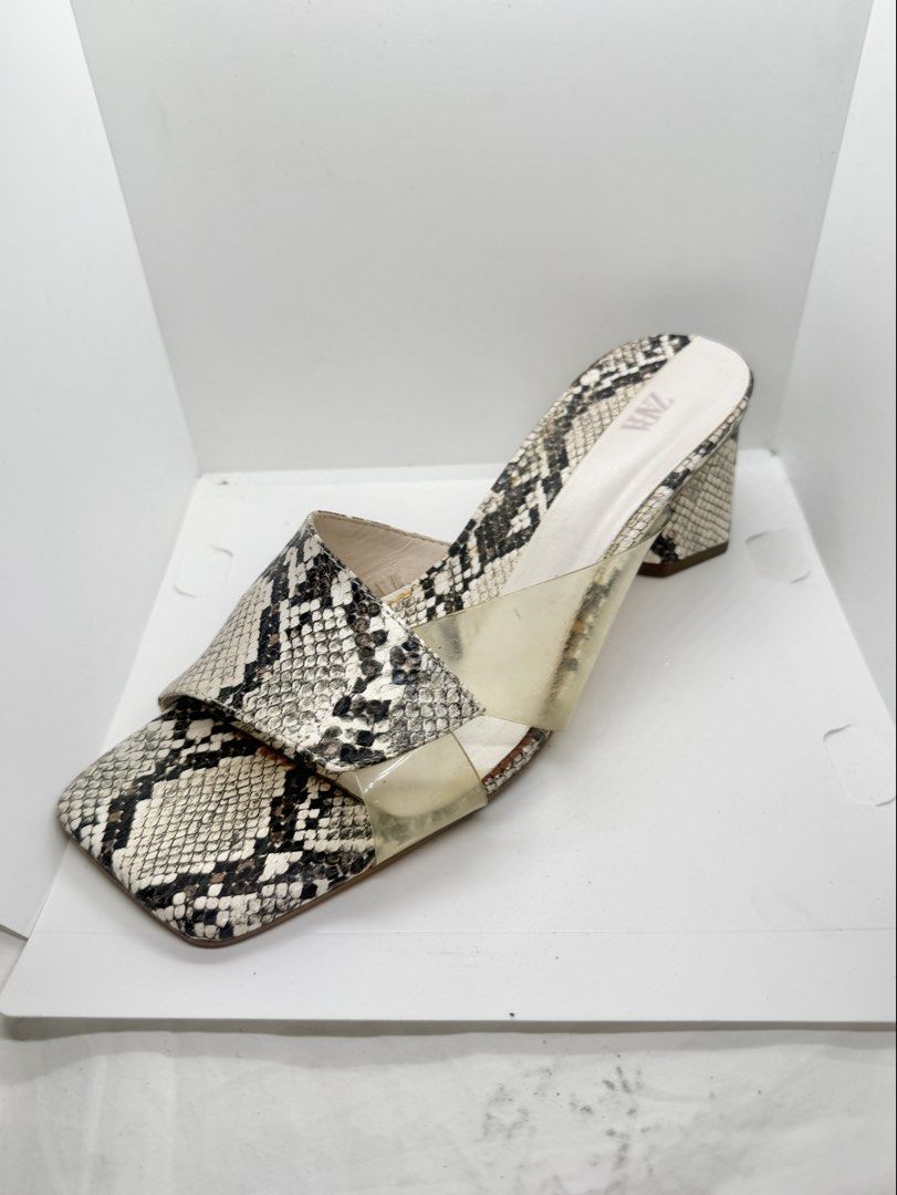 ZARA snake skin slide sandals (Category: Sandals) located in Mandaluyong City. Submitted by cherryspicks (Listing ID 1445690088, Image 3). Description: Worn 3x. The see-through part has discolored but when worn it is not obvious . Featuring a comfortable block heel. Size US 8.