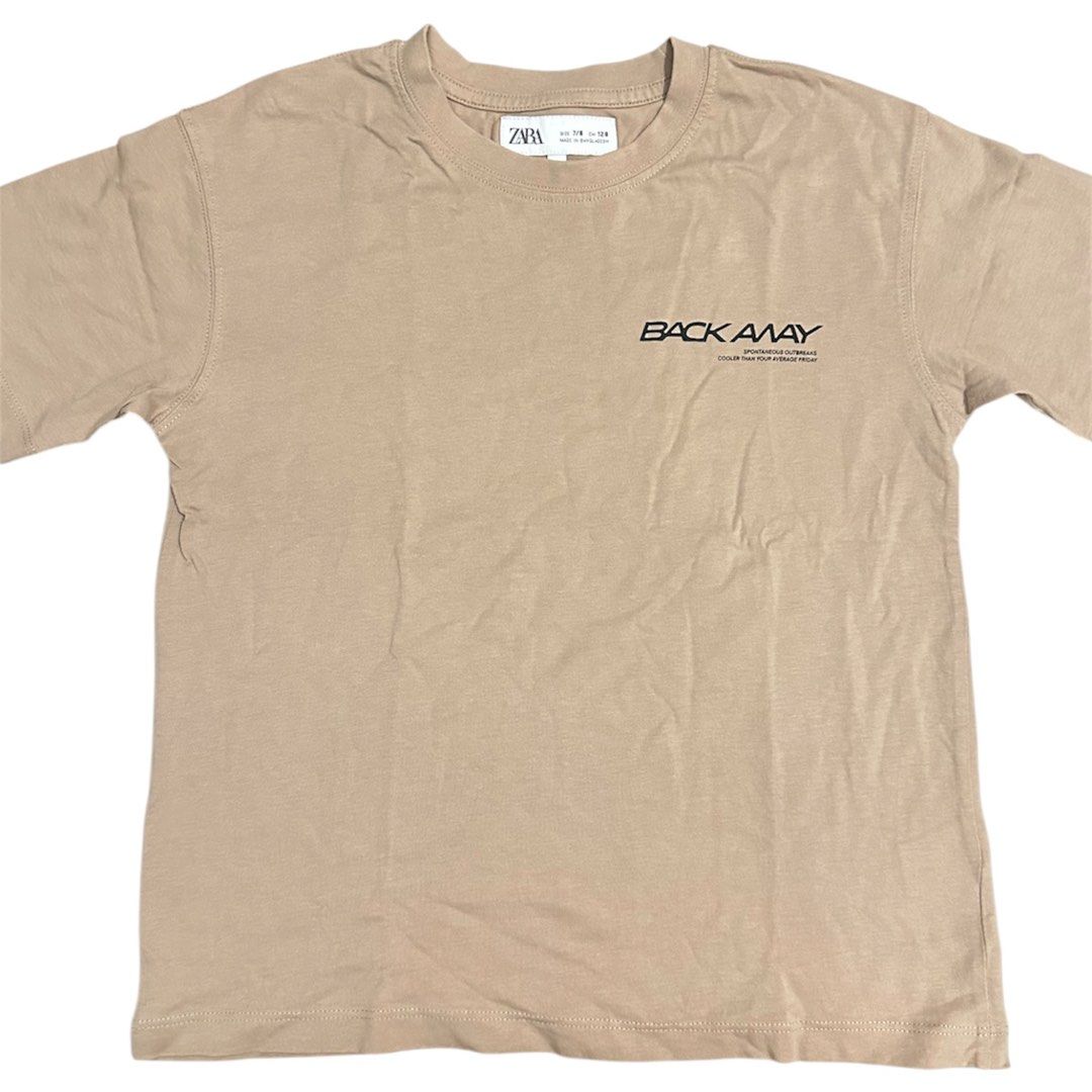 Zara T-shirt "BACK AWAY" Graphic Tee (Category: Babies & Kids Fashion) located in Caloocan City. Submitted by 4mscloset (Listing ID 1445679317, Image 1). Description: - Zara T-shirt - Color: Light Tan/Beige - Style: Crew neck, short sleeves - Occasion: Casual wear -condition 9/10 -size 7/8 128cm .