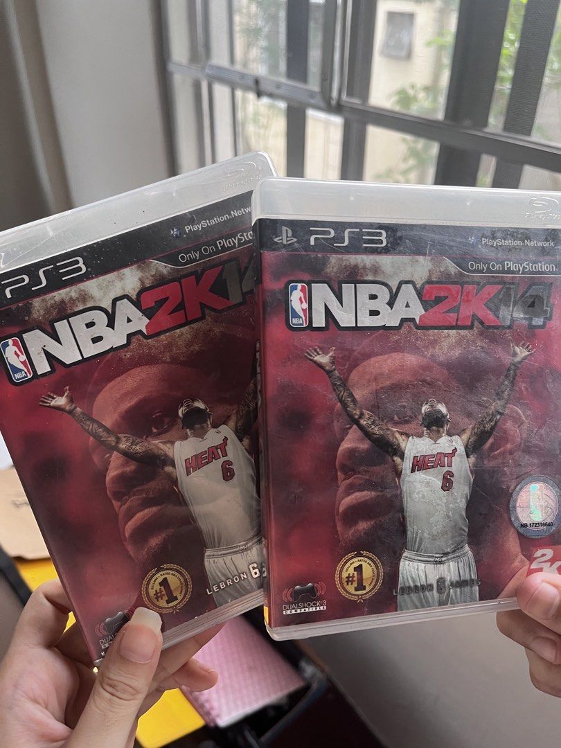 2x PS3 NBA 2K14 Games - LeBron James Edition (Category: PlayStation) located in Manila. Submitted by hachi_neko (Listing ID 1445888240, Image 1). Description: - Two copies of NBA 2K14 for PlayStation 3 available. - Features LeBron James on the cover. - Both discs are in their original cases. - Perfect for basketball fans looking for a classic sports game..
