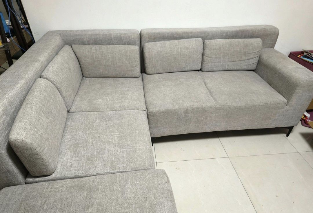 Abenson Jianvi Corner Sofa - Grey Fabric (Category: Sofas) located in Manila. Submitted by happymoon_a0aa3e (Listing ID 1445798555, Image 1). Description: - Modern grey fabric corner sofa - Detachable back pillows for customizable comfort - Sleek and contemporary design, perfect for living rooms - Purchased from Abenson Reason for selling: Magmove-out. Hindi kasya sa lilipatang bahay. Issue: may konting stains. kaya pa matanggal pag pinalinis. - 
