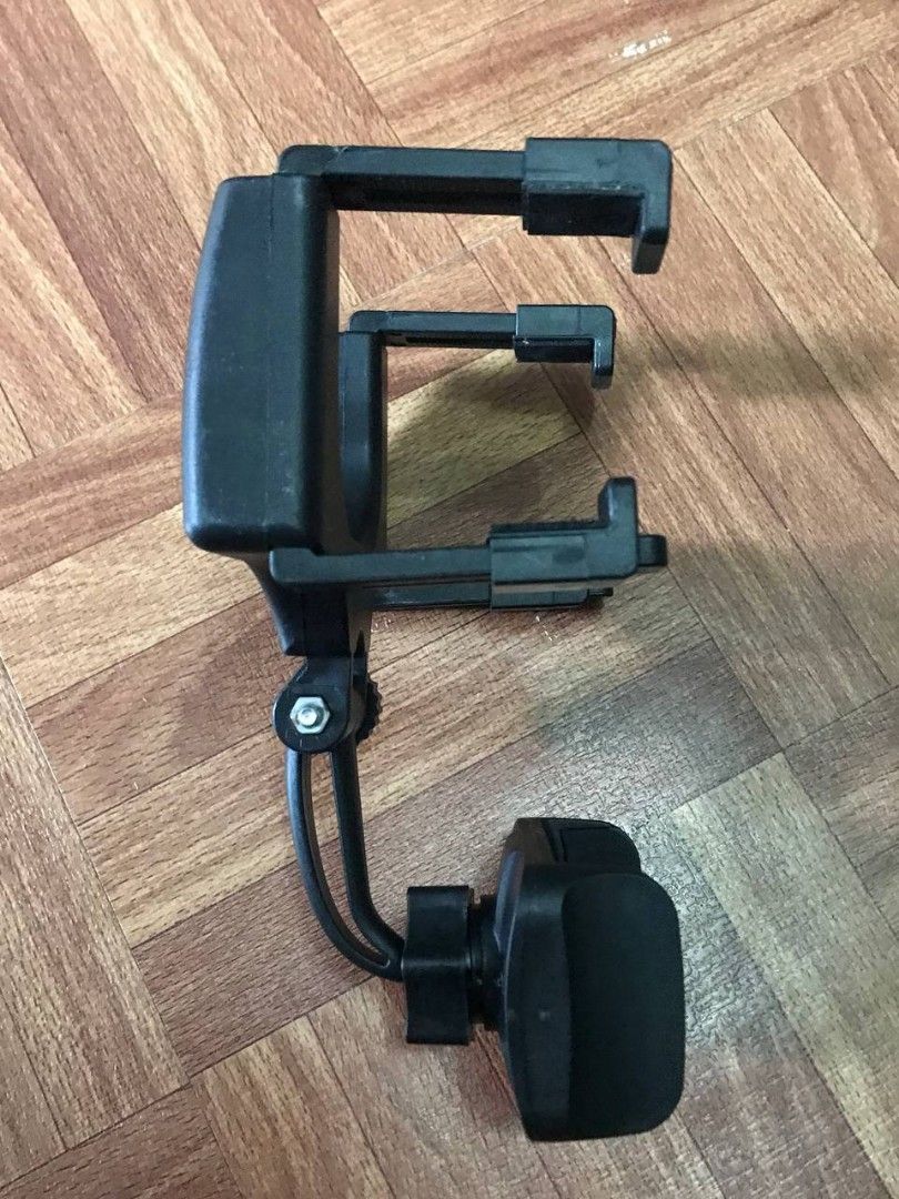 Adjustable Car Phone Holder Mount (Category: Mounts & Holders) located in Valenzuela. Submitted by ramz.sheyn (Listing ID 1445819256, Image 3). Description: - Clips securely onto your car's rearview mirror - Adjustable clamps accommodate various phone sizes - 360-degree rotatable mount for optimal viewing angles - Ideal for hands-free calls and GPS navigation while driving.