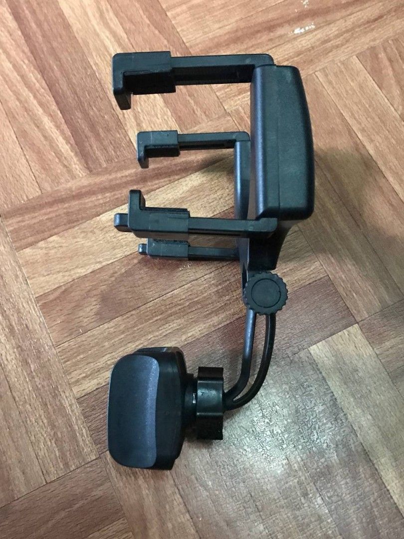 Adjustable Car Phone Holder Mount (Category: Mounts & Holders) located in Valenzuela. Submitted by ramz.sheyn (Listing ID 1445819256, Image 2). Description: - Clips securely onto your car's rearview mirror - Adjustable clamps accommodate various phone sizes - 360-degree rotatable mount for optimal viewing angles - Ideal for hands-free calls and GPS navigation while driving.