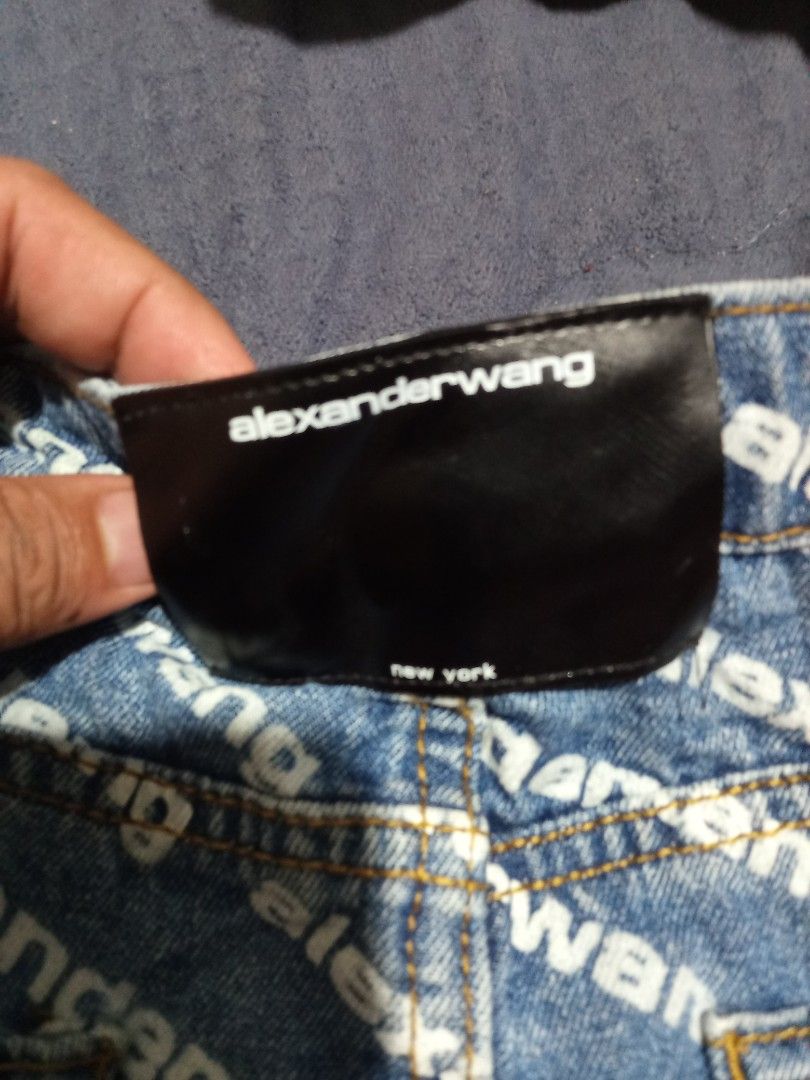 Alexander Wang All Over Logo Denim Shorts (Category: Shorts) located in Valencia. Submitted by cabisaythriftshop (Listing ID 1445936884, Image 3). Description: - Alexander Wang denim shorts - All-over logo print - Distressed hem detail - Size: 28 - Made in USA - Perfect statement piece for your wardrobe.