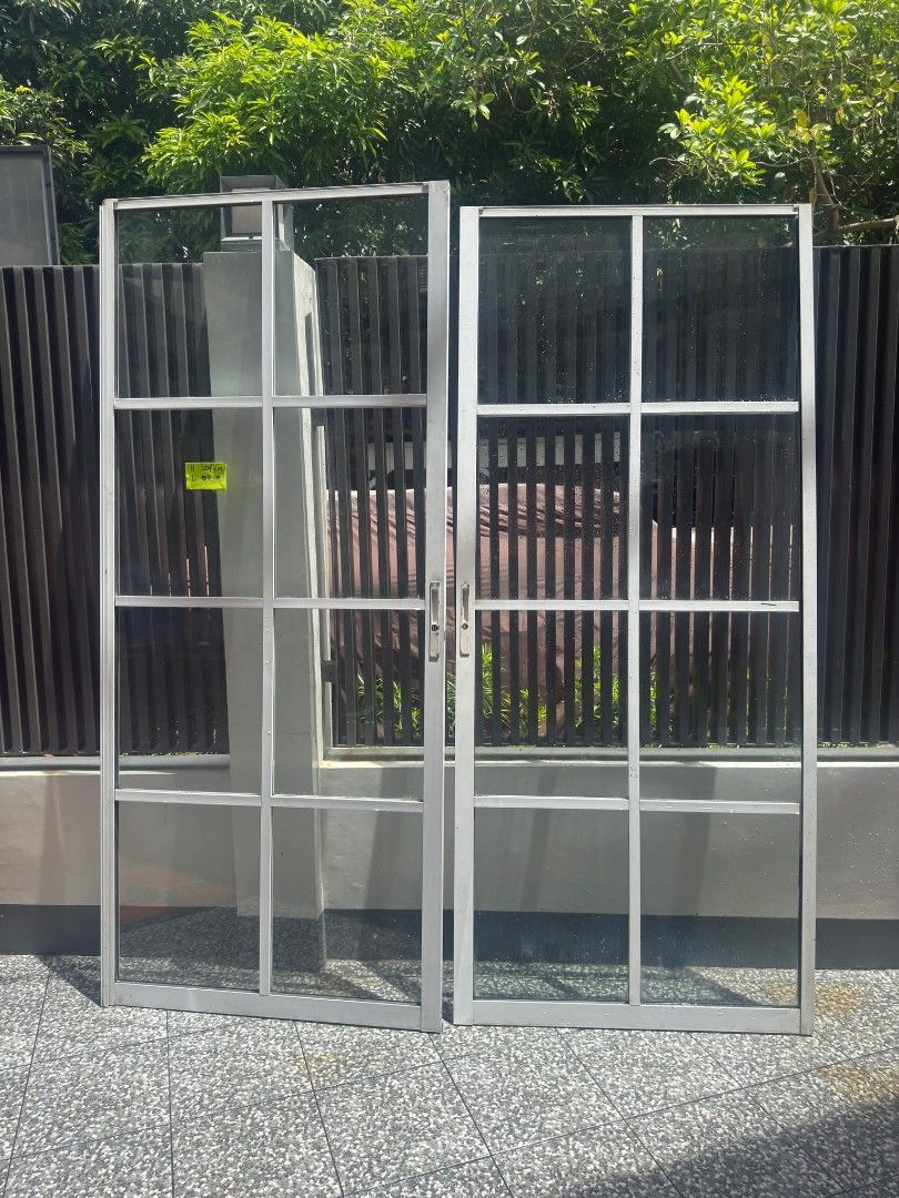 Aluminum Door Frame with Glass Panels (Category: Other Home Furniture) located in Manila. Submitted by practical_mom (Listing ID 1445815091, Image 1). Description: - Set of 2 aluminum door frames - Each frame has multiple glass panels - Dimensions: Approx. 204 cm (height) x 88 cm (width) - Ideal for door replacement or new installations -Used as Sliding doors - No frames included -Can be sold separately or in pair.