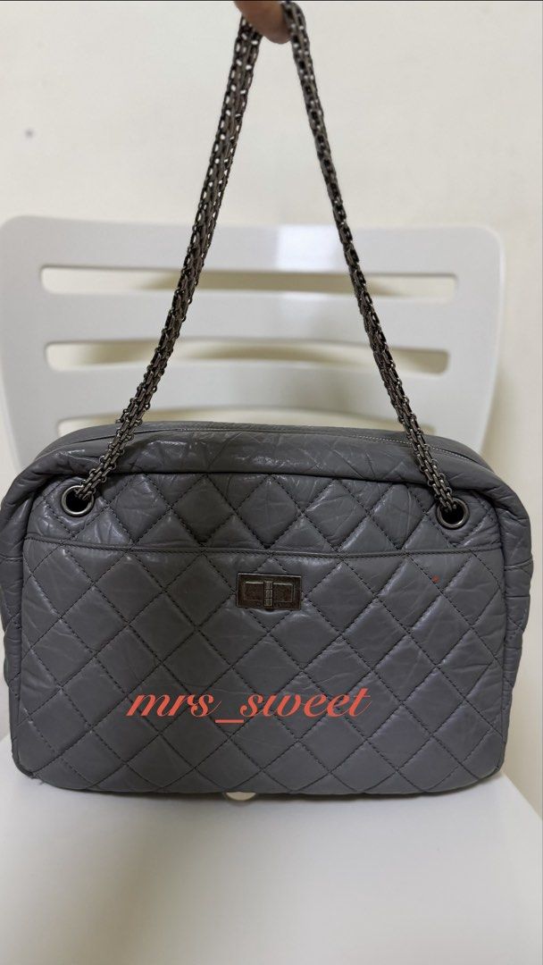 Authentic Chanel Reissue 2.55 Grey Leather Shoulder Bag (Category: Luxury Bags & Wallets) located in Valenzuela. Submitted by mrs_sweet (Listing ID 1445816597, Image 2). Description: - Authentic Grey Leather Chanel Reissue 2.55 Bag Large Camera Bag - Iconic Quilted Design - Silver-Tone Turn-Lock Closure - Versatile Double Chain Strap - Classic Flap Style - Suitable for Day or Night Wear - Stain on 1 side of the bag (another bag material got stick