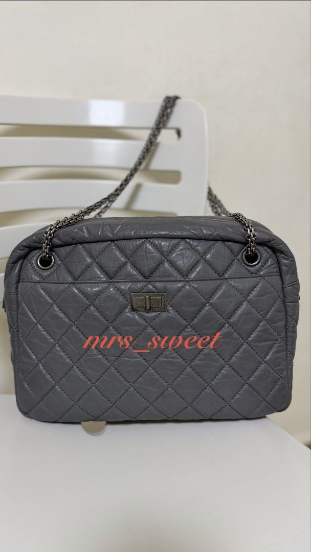 Authentic Chanel Reissue 2.55 Grey Leather Shoulder Bag (Category: Luxury Bags & Wallets) located in Valenzuela. Submitted by mrs_sweet (Listing ID 1445816597, Image 1). Description: - Authentic Grey Leather Chanel Reissue 2.55 Bag Large Camera Bag - Iconic Quilted Design - Silver-Tone Turn-Lock Closure - Versatile Double Chain Strap - Classic Flap Style - Suitable for Day or Night Wear - Stain on 1 side of the bag (another bag material got stick