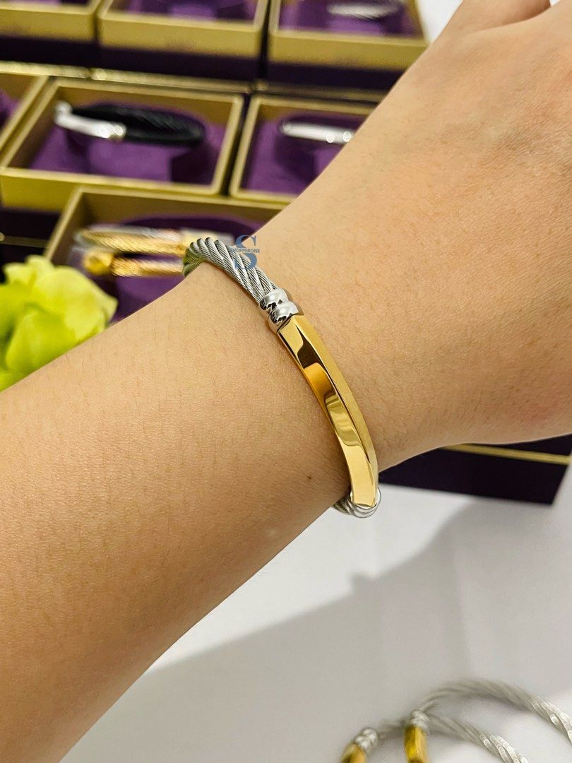 Authentic Charriol Better Half Bangle Steel/Yellow gold (Category: Bracelets) located in Taguig. Submitted by shopperone_usa (Listing ID 1445929942, Image 3). Description: 🔹 ON HAND in Manila, ready to ship 🔹💯 Authentic & Brand New 🔹 Sourced directly from the Brand’s official store 🔹 04-104-1273-0 Available Size: S M L Stainless steel cable (5mm) bangle Yellow Gold PVD rectangular prism decor with easy on & off magnetic clasp 🔹 COPYRIGHTS &