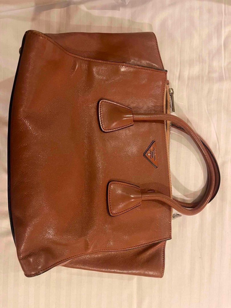 Authentic Prada Twin Pocket (Category: Luxury Bags & Wallets) located in Quezon City. Submitted by declutterwithkc (Listing ID 1445805922, Image 1). Description: Rfs: decluttering/ personal item top handle/ cross body bag clean interiors bought usa Negotiable for sure buyer. Meetup only Baguio. If shipped, full pay first..