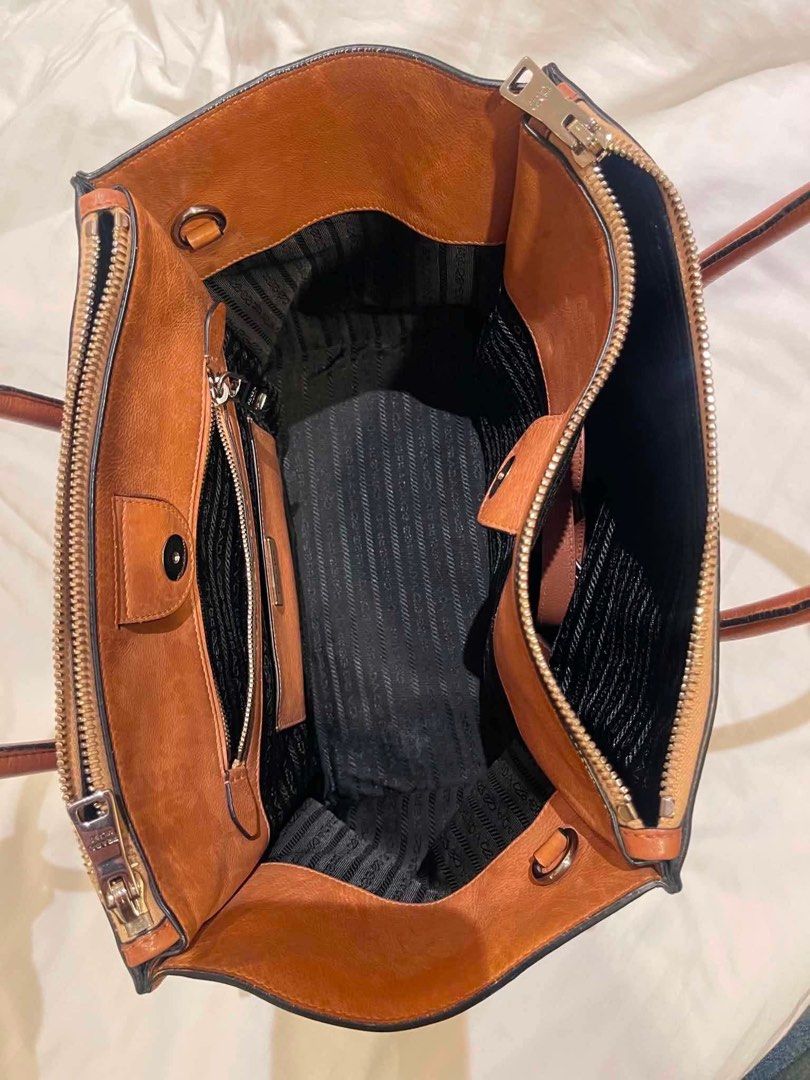 Authentic Prada Twin Pocket (Category: Luxury Bags & Wallets) located in Quezon City. Submitted by declutterwithkc (Listing ID 1445805922, Image 2). Description: Rfs: decluttering/ personal item top handle/ cross body bag clean interiors bought usa Negotiable for sure buyer. Meetup only Baguio. If shipped, full pay first..