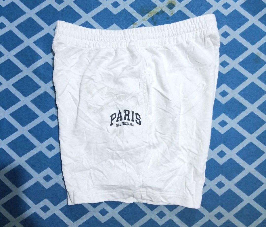 Balenciaga Paris Logo White Shorts (Category: Shorts) located in Cavite. Submitted by autothrift (Listing ID 1445979998, Image 1). Description: WAIST 29-36 LENGTH 18 NEED WASH - White shorts - Features 'PARIS BALENCIAGA' logo - Made in Portugal - Comfortable fit - Perfect for casual wear.