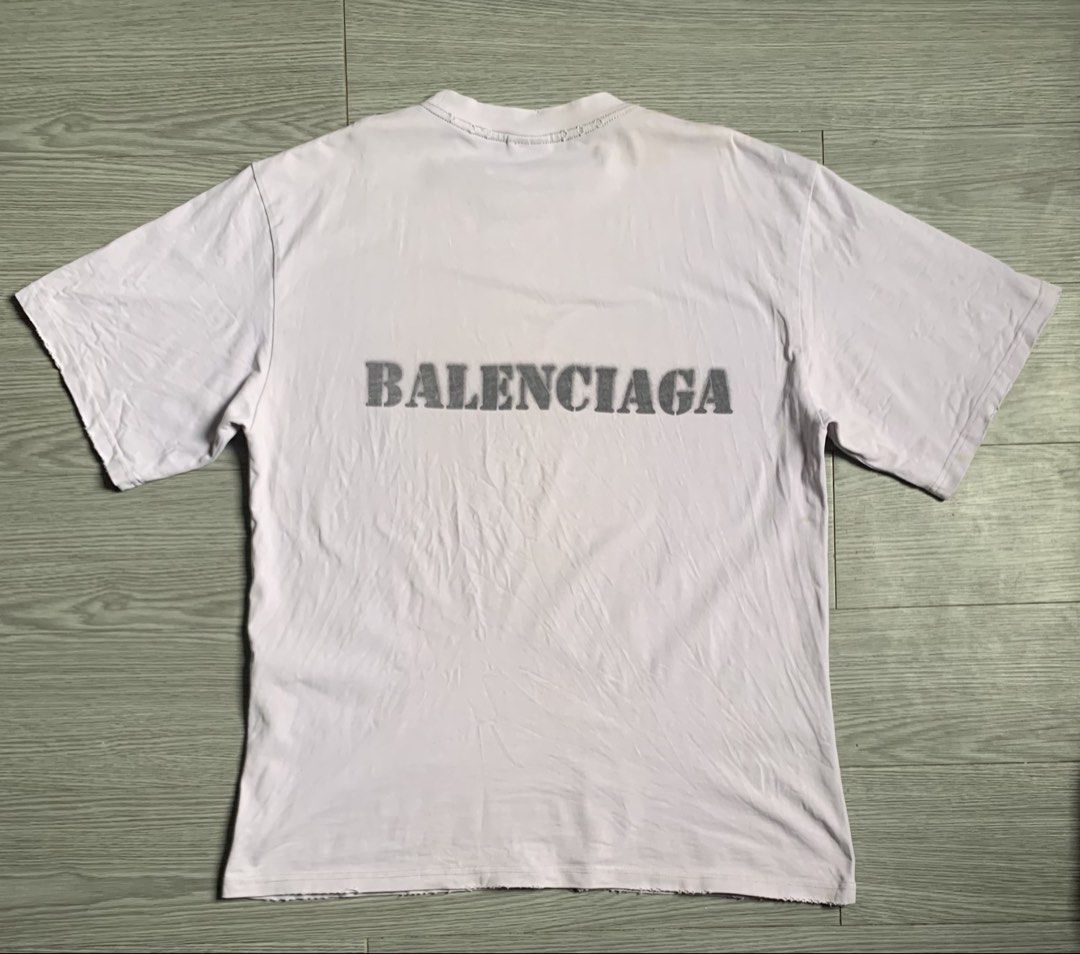 Balenciaga Stencil Type T-Shirt (Category: Luxury Apparel) located in Pozorrubio. Submitted by plco. (Listing ID 1444429495, Image 2). Description: Balenciaga Stencil Type T-Shirt in white vintage jersey featuring a distressed, stencil-style logo. S on tag 23x30 color rate: 9.5/10 complete tags excellent condition need wash only no issue.