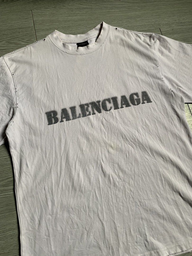 Balenciaga Stencil Type T-Shirt (Category: Luxury Apparel) located in Pozorrubio. Submitted by plco. (Listing ID 1444429495, Image 3). Description: Balenciaga Stencil Type T-Shirt in white vintage jersey featuring a distressed, stencil-style logo. S on tag 23x30 color rate: 9.5/10 complete tags excellent condition need wash only no issue.