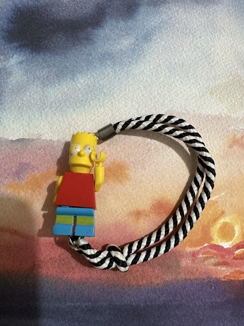 Bart Simpson Lego Keychain with Black and White Rope (Category: Character Goods) located in Naga. Submitted by bag.net (Listing ID 1445931740, Image 3). Description: - Cute Bart Simpson keychain (from Japan 🇯🇵 ₱ - Lego-style figure - Braided black and white rope - Durable metal clasp - Ideal for bags, keys, or as a fun accessory for any fan -collectible item!!!(rare).