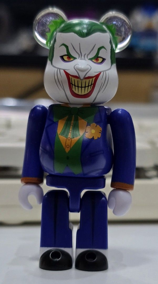 Bearbrick Joker Figure (Category: Designer & Blind Box Toys) located in Taguig. Submitted by cardboardislife (Listing ID 1445832529, Image 1). Description: - Cool Bearbrick figure designed as The Joker - Features his iconic purple suit and green hair - Stands approximately 7 inches tall - Ideal for display on shelves or desks - A must-have collectible for Batman and DC Comics fans.