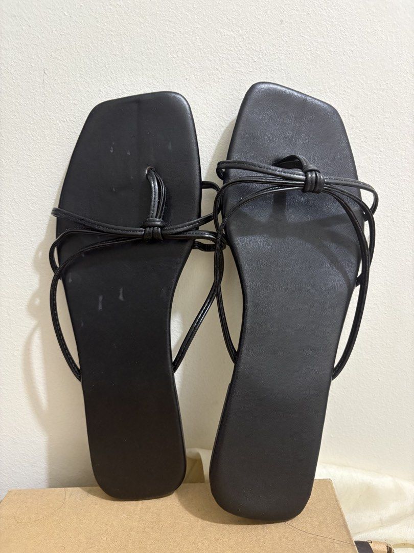Black Square Toe Thong Sandals with Bow Detail (Category: Flats & Sandals) located in Solano. Submitted by zaillan (Listing ID 1445964640, Image 2). Description: SIZE 41 ON TAG BUT BEST FITS SIZE 40 - Stylish black thong sandals - Trendy square toe design - Comfortable flat sole - Easy slip-on style.