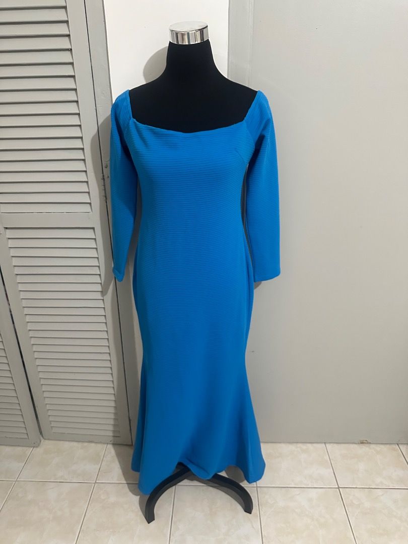 Blue Long Sleeve Fishtail Maxi Dress (Category: Dresses) located in Balanga. Submitted by ruffa_assorted_item (Listing ID 1445811813, Image 1). Description: - Stunning blue maxi dress - Long sleeves - Flattering square neckline - Elegant fishtail hemline - Textured fabric for a unique look - Convenient back zipper closure - Ideal for special events or a glamorous night out.