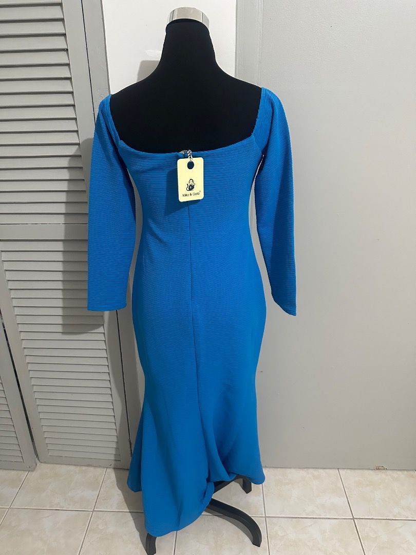 Blue Long Sleeve Fishtail Maxi Dress (Category: Dresses) located in Balanga. Submitted by ruffa_assorted_item (Listing ID 1445811813, Image 2). Description: - Stunning blue maxi dress - Long sleeves - Flattering square neckline - Elegant fishtail hemline - Textured fabric for a unique look - Convenient back zipper closure - Ideal for special events or a glamorous night out.