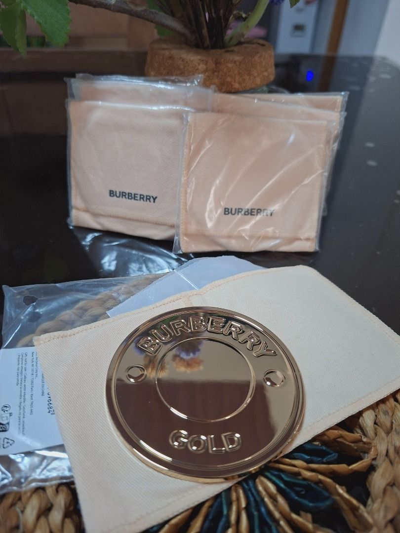 Burberry Gold Compact Mirror with Pouches (Category: Accessory Holder, Box & Organizers) located in Tuguegarao City. Submitted by thosphbys49295 (Listing ID 1445884404, Image 3). Description: - Authentic Burberry compact mirror - Elegant gold finish - Engraved with 'Burberry Gold' - Comes with original dust pouches (multiple included) - Compact and portable for easy touch-ups.