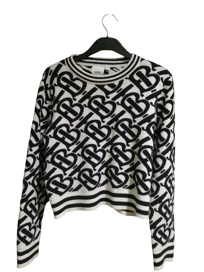 Burberry Monogram Knit Sweater (Category: Luxury Apparel) located in Pasay City. Submitted by olxph_247751200 (Listing ID 1445841385, Image 1). Description: - Authentic Burberry knit sweater - All-over black and white monogram print - Crew neck with striped trim - Long sleeves with striped cuffs - Cropped fit - Perfect statement piece for any outfit.